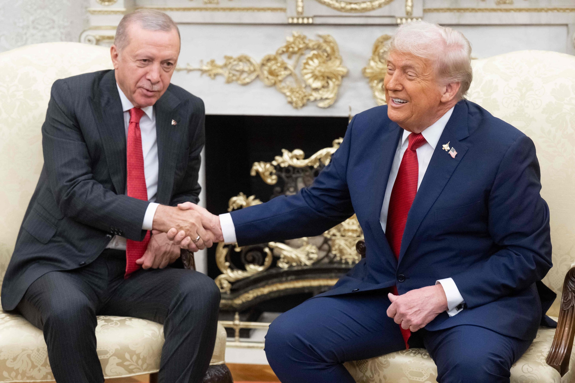 US President Donald Trump shakes hands with Turkey's President Recep Tayyip Erdogan as they meet in the Oval Office of the White House in Washington, DC on September 25, 2025.