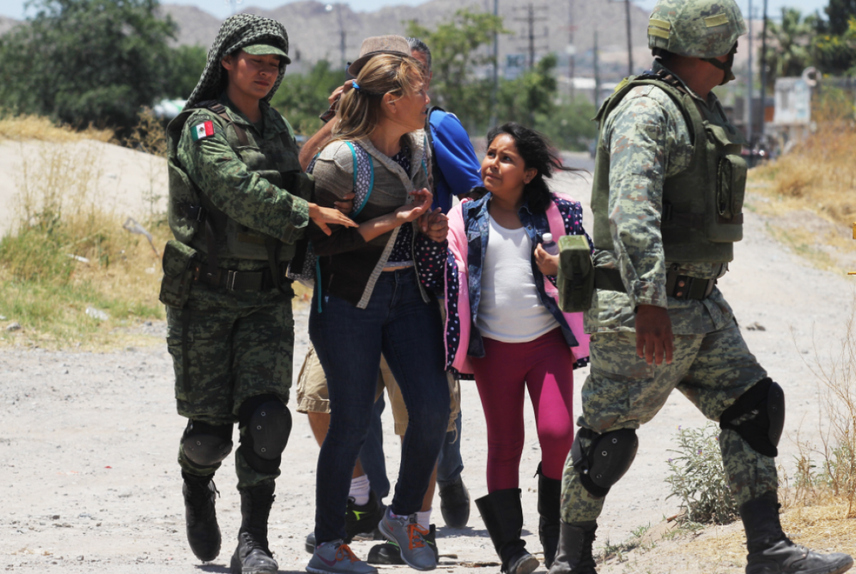 Members of Mexican National Guard detain Central American migrants trying to cross the Rio Bravo, in Ciudad Juarez, State of Chihuahua, on June 21, 2019. (Getty)