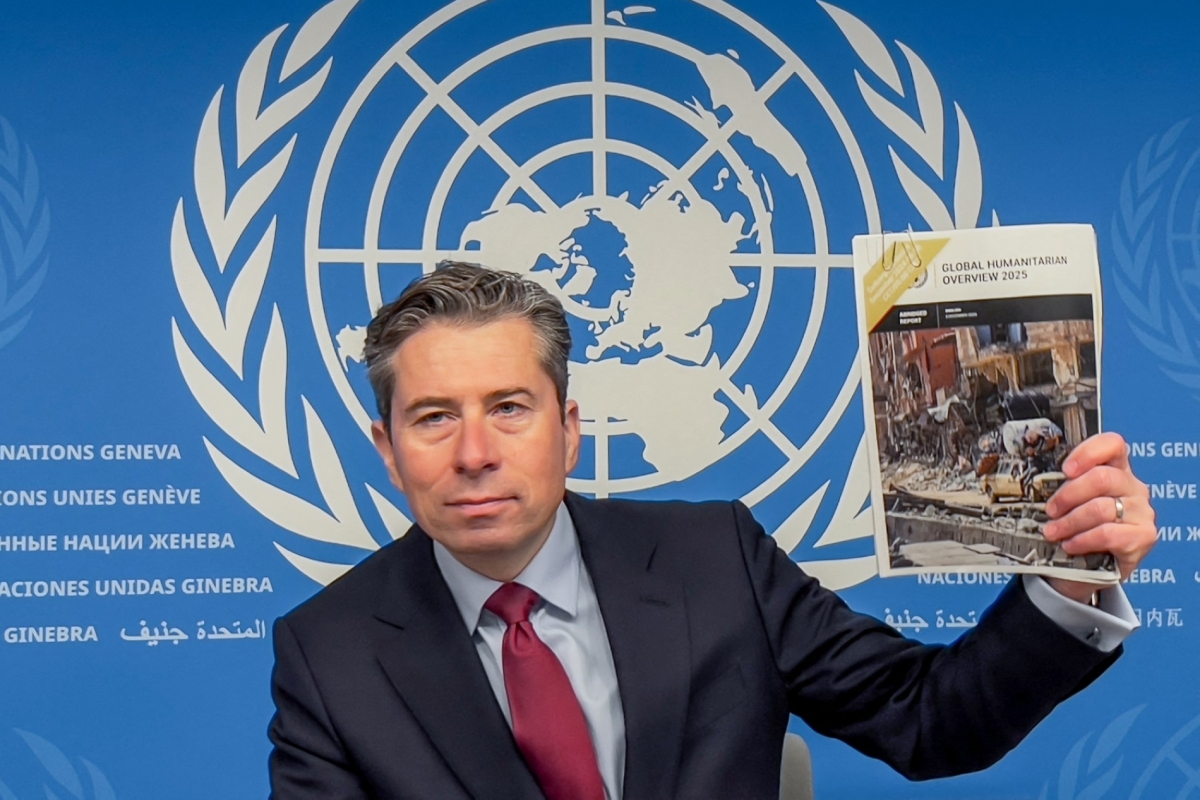 UN Humanitarian Affairs and Emergency Relief Coordinator (OCHA) Under-Secretary-General Tom Fletcher holds the
Global Humanitarian Overview 2025 report during a press conference in Geneva on December 3, 2024. 