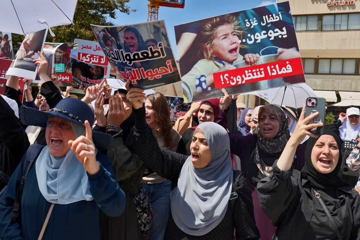 Palestinian citizens of Israel protest near the Egyptian embassy in Tel Aviv, against the closure of the Rafah crossing and the catastrophic humanitarian situation in the Gaza Strip on July 31, 2025.
