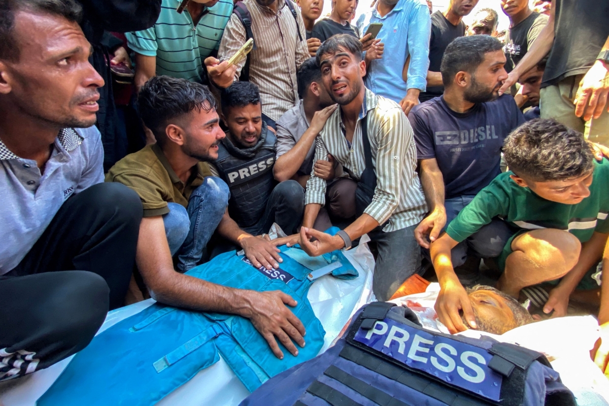 People mourn for Palestinian journalists Moaz Abu Taha and Hussam al-Masri, a Reuters contractor, who were killed in an Israeli strike on Nasser hospital in Khan Yunis in Gaza on August 25, 2025, along with 15 others.