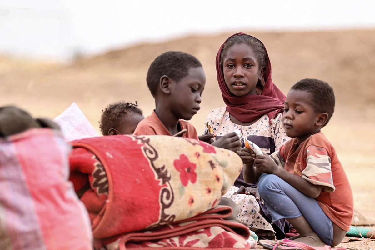 Displaced Sudanese children gather at a camp near the town of Tawila in North Darfur on February 11, 2025, amid the ongoing war between the army and paramilitary forces.
