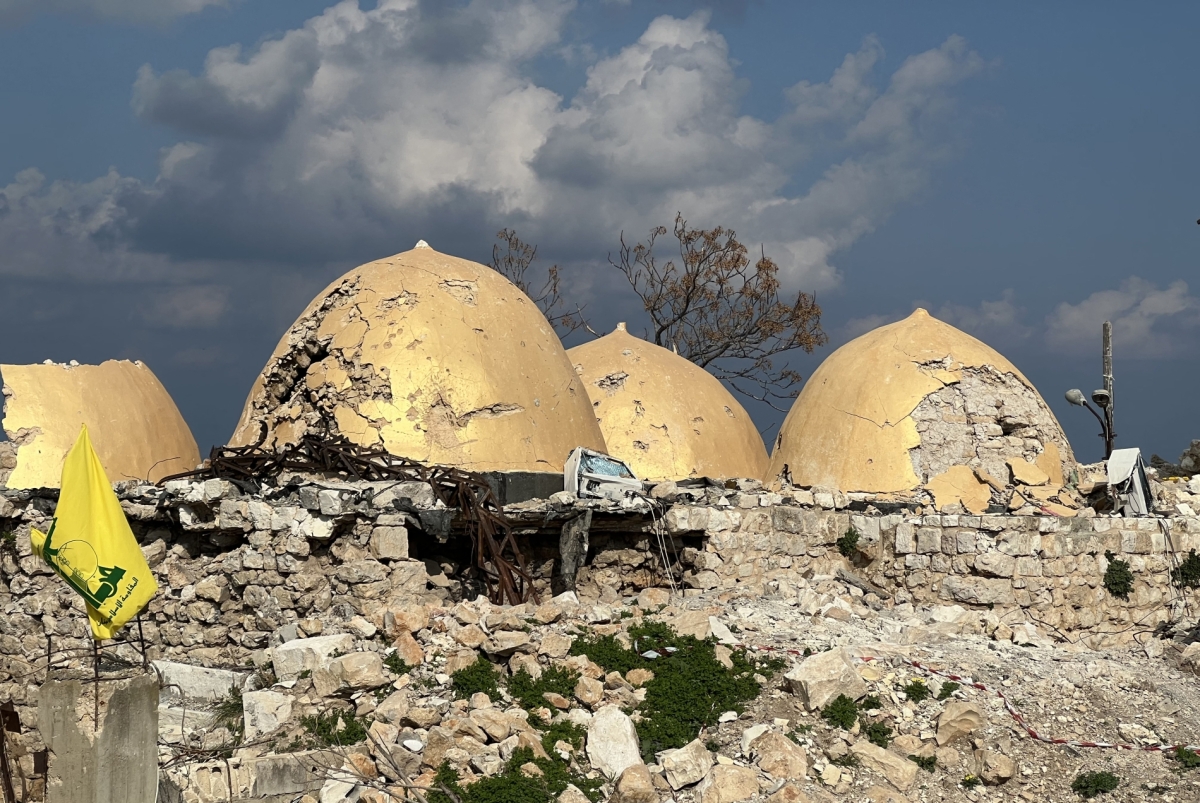 A Hezbollah flag is placed in front of the shrine of Shamoun al-Safa, built within a castle in the village of Shamaa in southern Lebanon&#039;s Tyre governorate, on January 31, 2025, that was heavily damaged by Israeli bombing. 