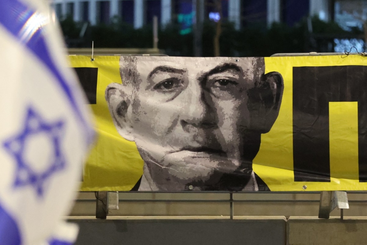 A portrait of Israel's Prime Minister Benjamin Netanyahu hangs during an anti-government protest calling for action to secure the release of Israeli hostages in Tel Aviv on March 29, 2025.