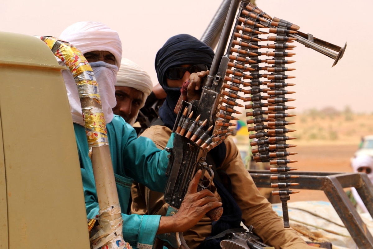 Armed men from the MSA, an armed political movement in Mali's Azawad region, gather in the desert outside Menaka on March 14, 2020.