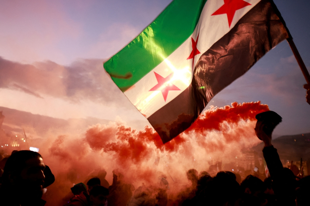 Syrians celebrate at Umayyad Square in Damascus on December 20, 2024, after the ousting of Syria's Bashar al-Assad on December 8.