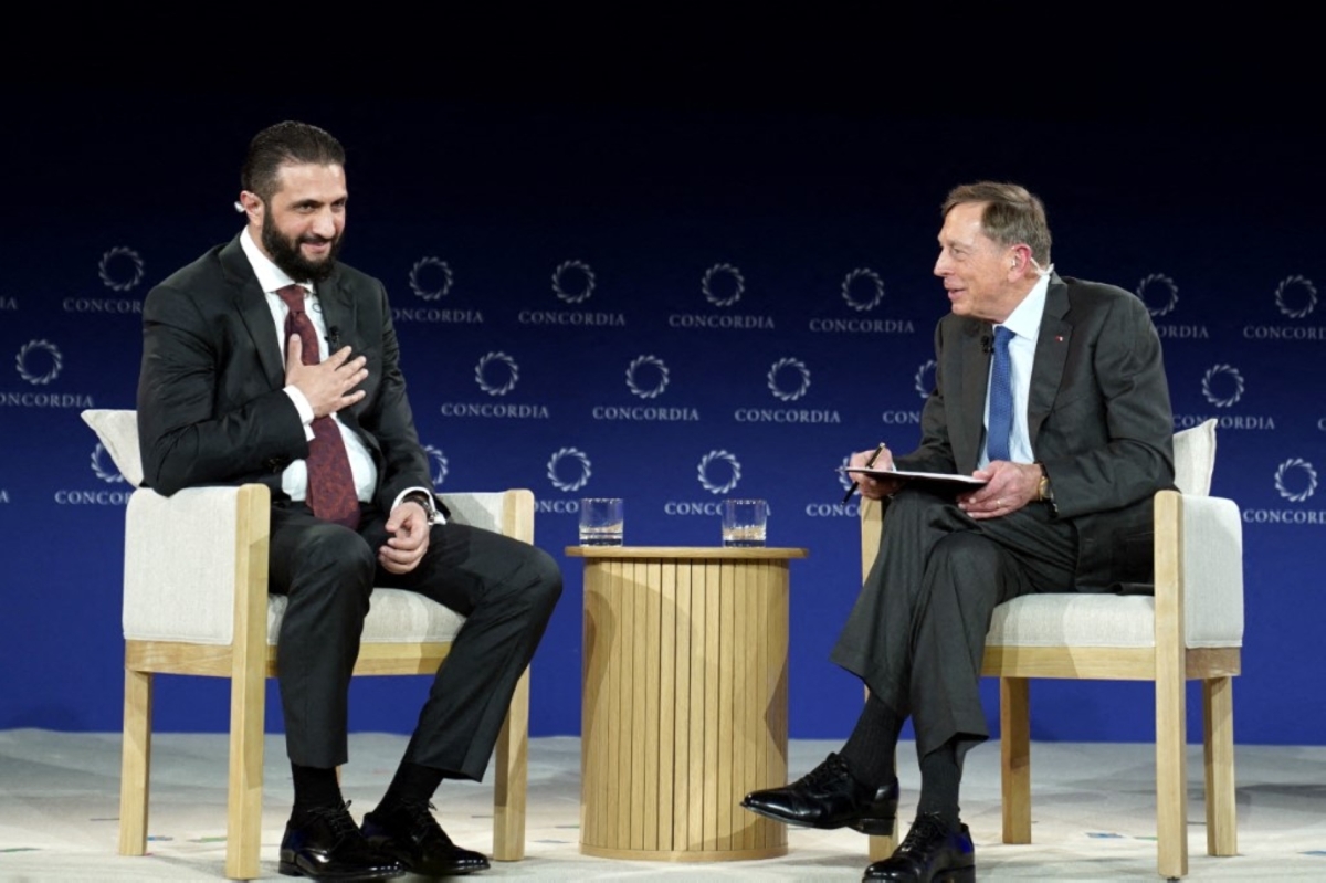 Ahmed al-Sharaa, President of the Syrian Arab Republic, and General David H. Petraeus (US Army, Ret.) speak onstage during the 2025 Concordia Annual Summit at Sheraton New York Times Square on September 22, 2025.