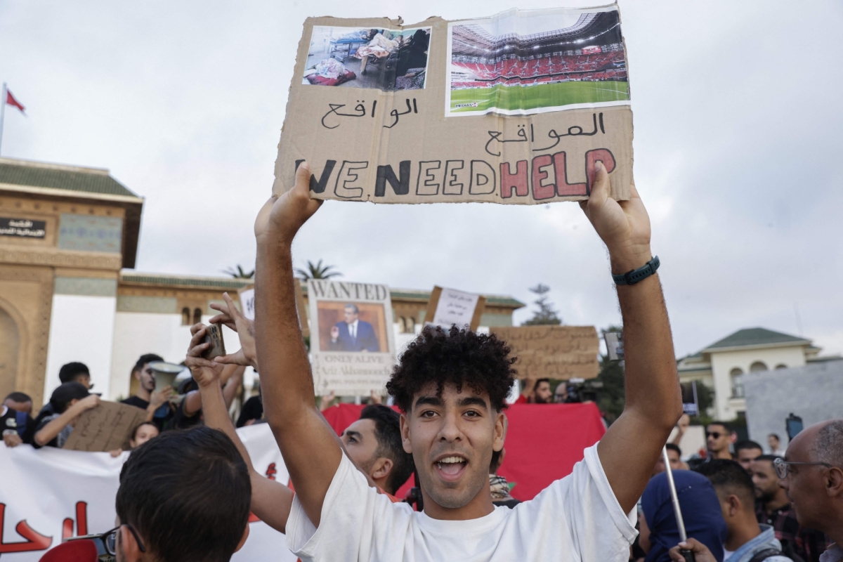 Demonstrators lift placards during a youth-led protest demanding reforms to public healthcare and education at Mohamed V square in Casablanca on October 6, 2025.