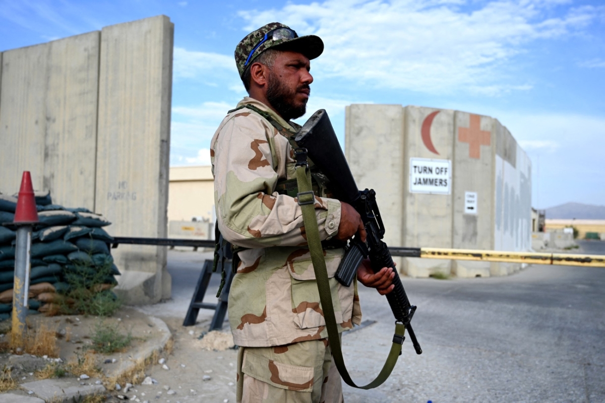 An Afghan National Army (ANA) soldier stands guard at a gate of a hospital inside the Bagram US air base after all US and NATO troops left, some 70 Km north of Kabul on July 5, 2021. 