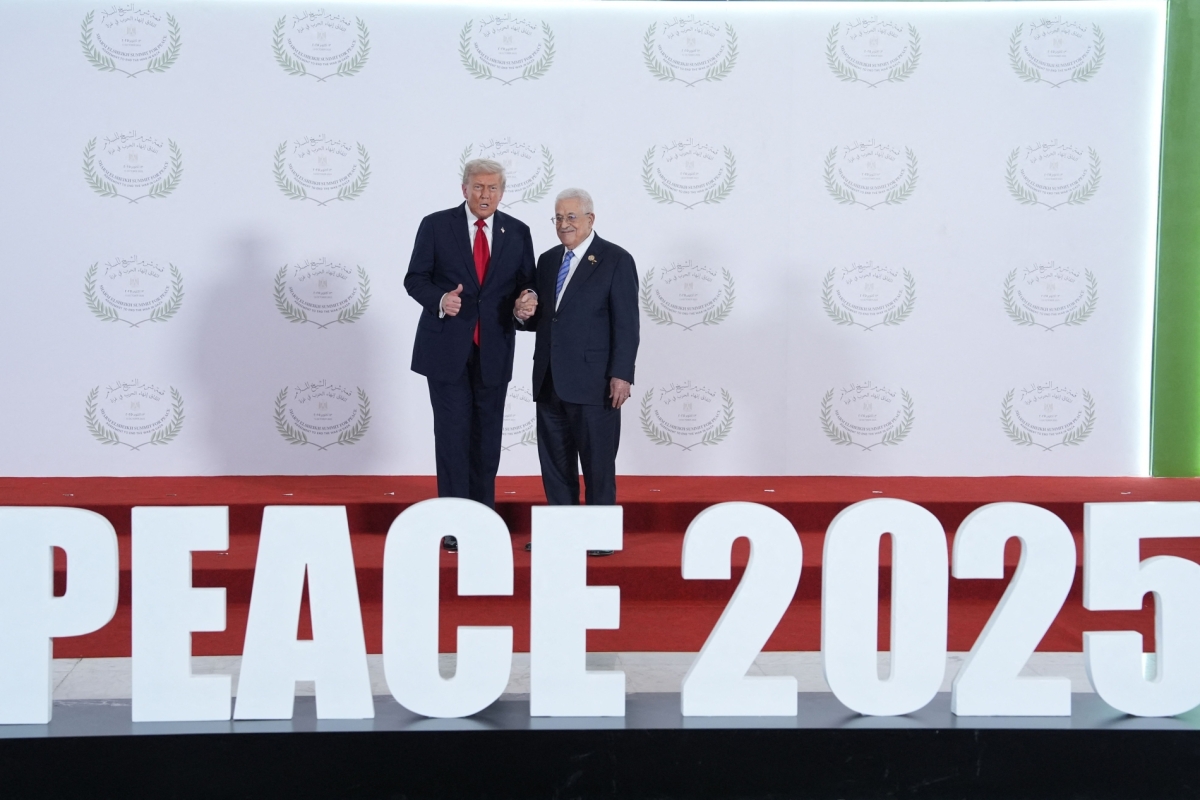US President Donald Trump greets Palestinian President Mahmud Abbas during a summit on Gaza in Sharm el-Sheikh on October 13, 2025.