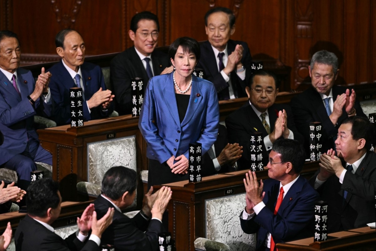LDP President Sanae Takaichi receives applause after she was selected as Japan's new prime minister during an extraordinary session of the lower house of parliament in Tokyo on October 21, 2025.