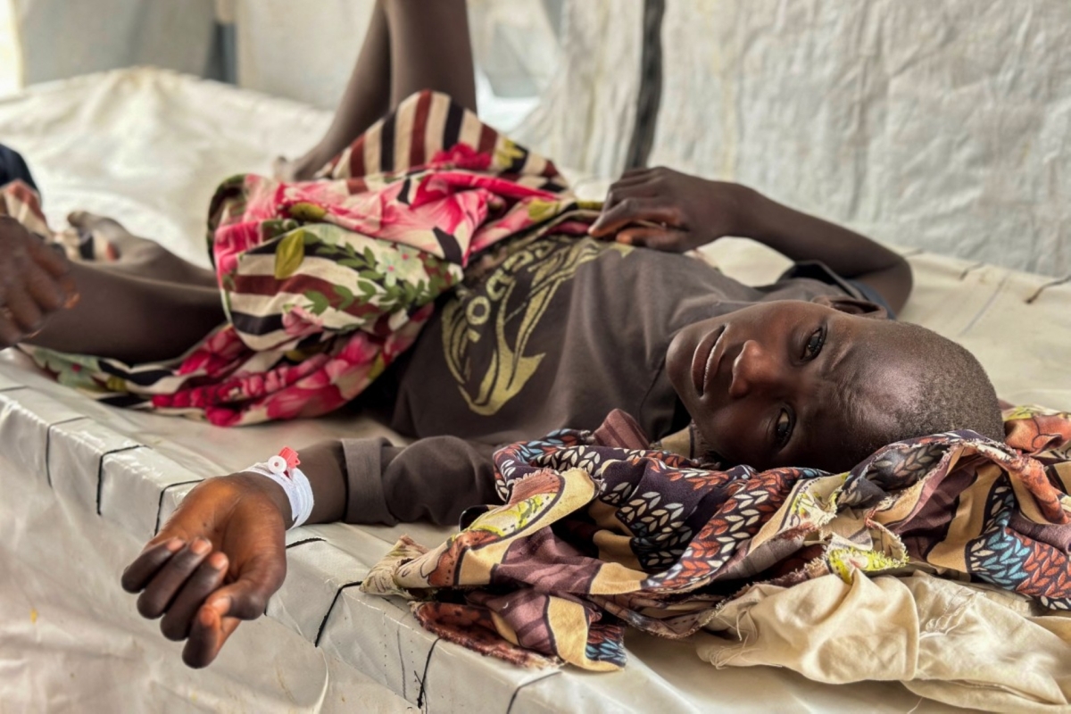 A child infected with cholera receives treatment in the cholera isolation centre at the refugee camps of western Sudan, in Tawila city in Darfur, on August 12, 2025