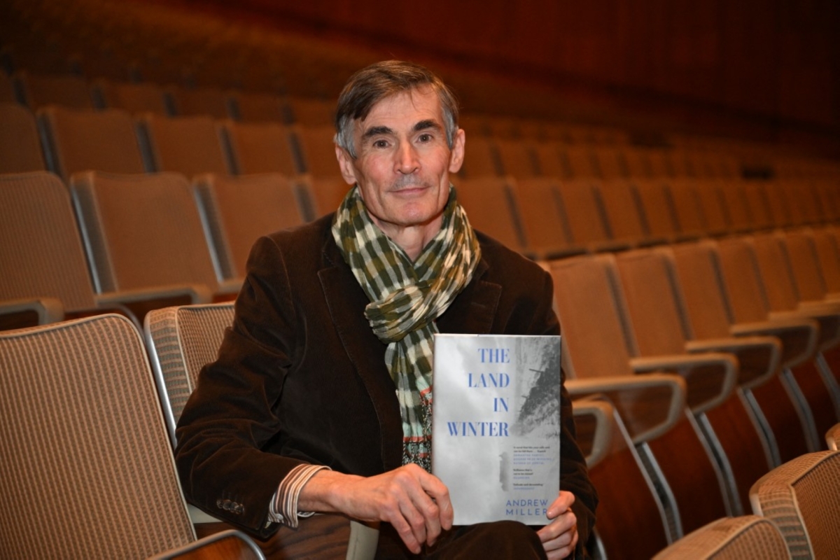 British author Andrew Millar holds his novel &quot;The Land in Winter&quot; during a photoshoot for the 2025 Booker Prize shortlist.