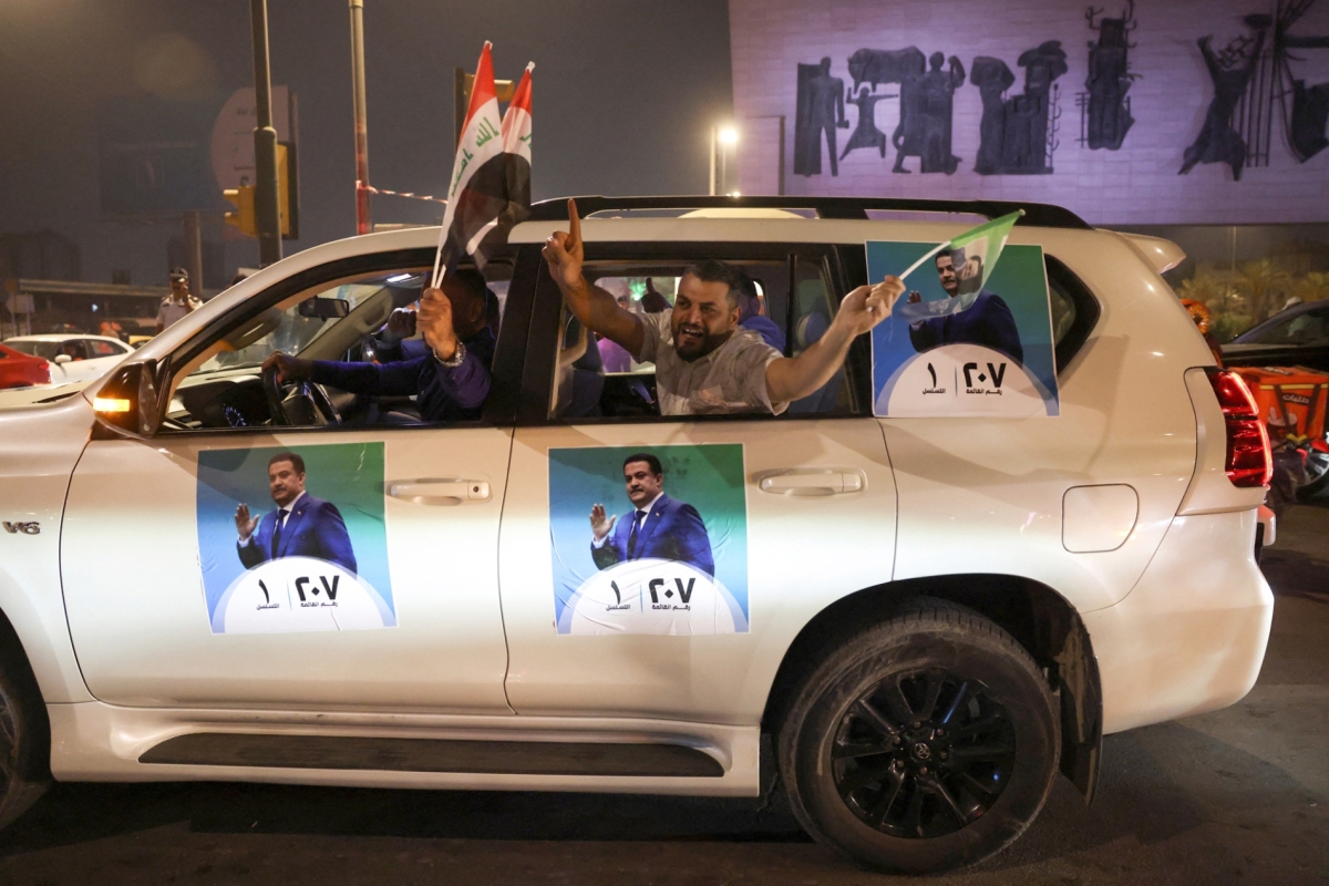 Supporters of the Reconstruction and Development Coalition celebrate after preliminary election results were announced in Baghdad, Iraq, on 12 November 2025. 