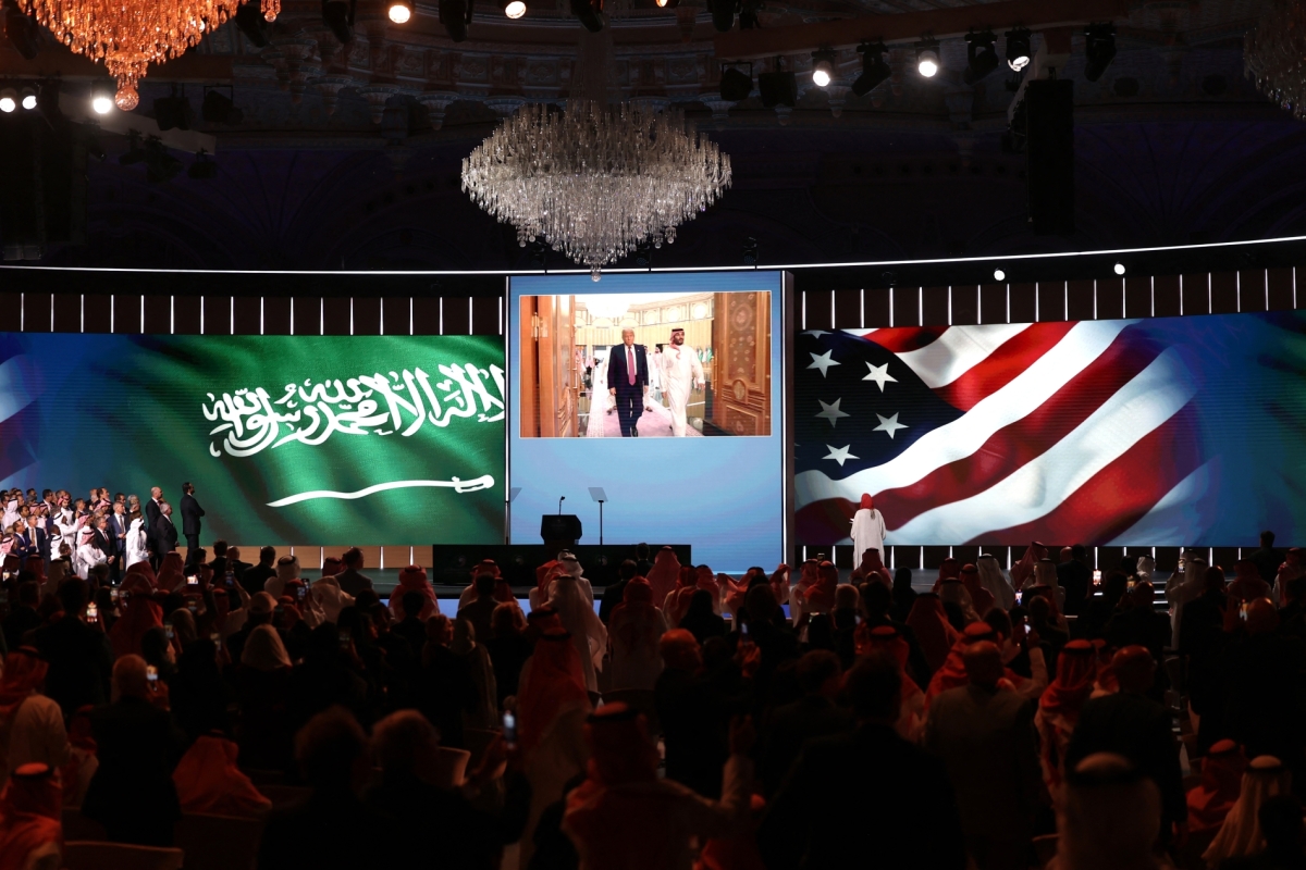 People look to a giant screen as US President Donald Trump and Saudi Crown Prince Mohammed bin Salman arrive for the Saudi-US investment forum at the King Abdul Aziz International Conference Centre in Riyadh on 13 May 2025. 