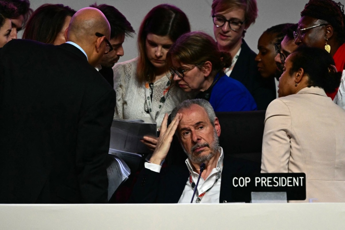 COP30 President Andre Correa do Lago gestures as the plenary session was interrupted following Colombia&#039;s  intervention at the COP30 UN Climate Change Conference in Belém, Pará state, Brazil, on 22 November 2025.