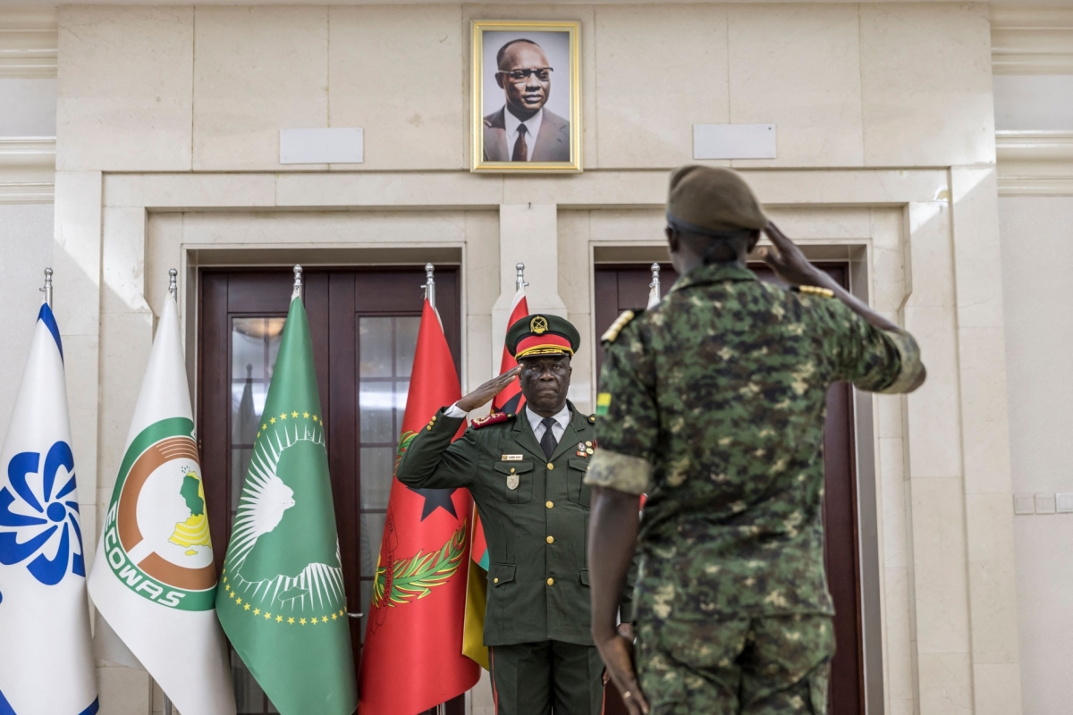 Transitional government President General Horta N'Tam salutes an army officer during the swearing in ceremony at the Presidential Palace in Bissau, on 28 November 2025. 