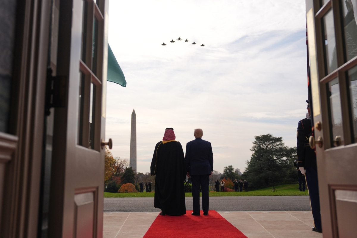 US President Donald Trump and Saudi Arabia's Crown Prince Mohammed bin Salman watch a flight of F-35's and F-15's during a welcome ceremony on the South Lawn of the White House, on 18 November 2025, in Washington.