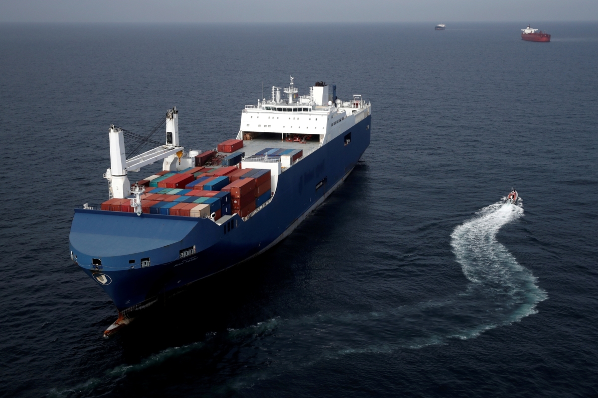 A French patrol boat sails next to the Bahri-Yanbu, a Saudi Arabian cargo ship, that waits to enter the French port of Le Havre on 10 May 2019. 