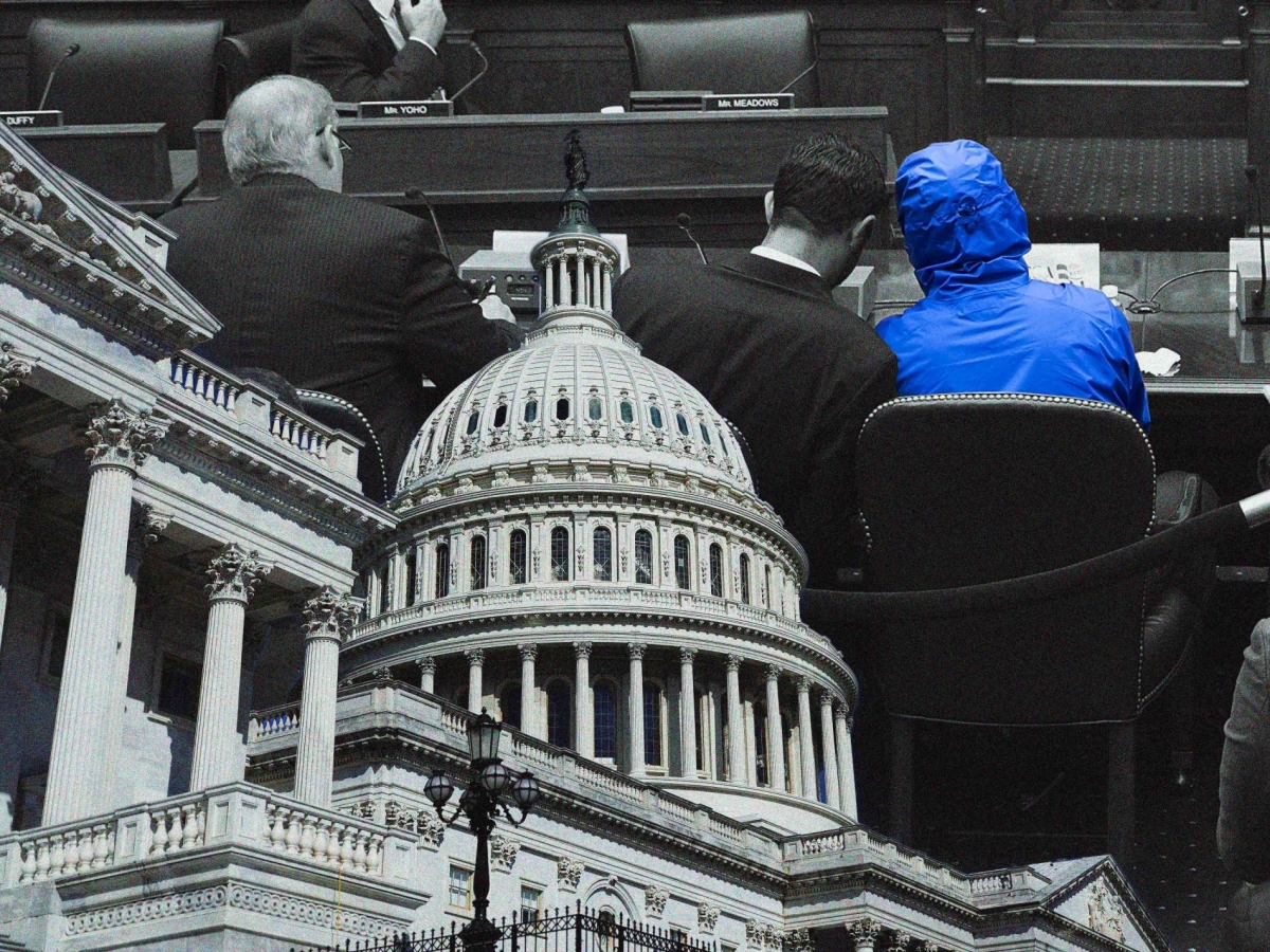 A picture of Farid al-Madhan, known as "Caesar," wearing a blue robe in the US Congress.
 
