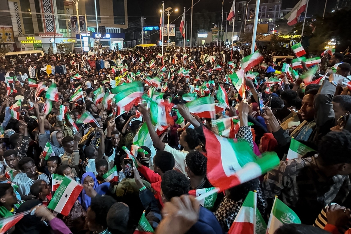 This aerial view shows residents waving Somaliland flags as they gather to celebrate Israel's announcement recognising Somaliland's statehood in downtown Hargeisa, on 26 December 2025. 