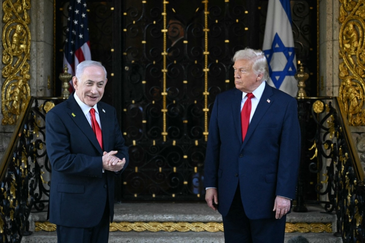 US President Donald Trump (R) and Israeli Prime Minister Benjamin Netanyahu (L) speak to reporters upon Netanyahu's arrival at Trump’s Mar-a-Lago residence in Palm Beach, Florida, on 29 December 2025.