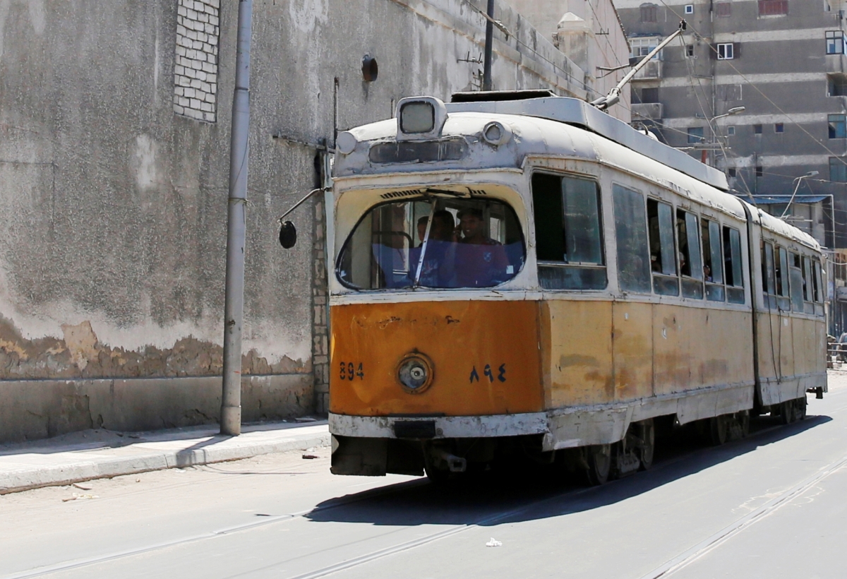 People ride in an old electric tram in Alexandria, Egypt, on 3 August 2017. 