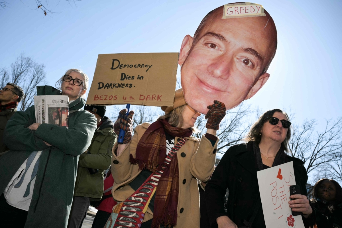 Washington Post employees, along with supporters from the Washington-Baltimore News Guild, rally outside the Washington Post office building in Washington, DC, on 5 February 2026.