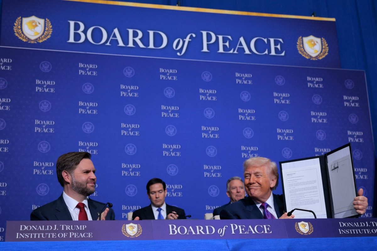 US President Donald Trump holds up a Memorandum of Understanding during the inaugural meeting of the Board of Peace at the Donald J. Trump Institute of Peace on 19 February 2026 in Washington, DC.
