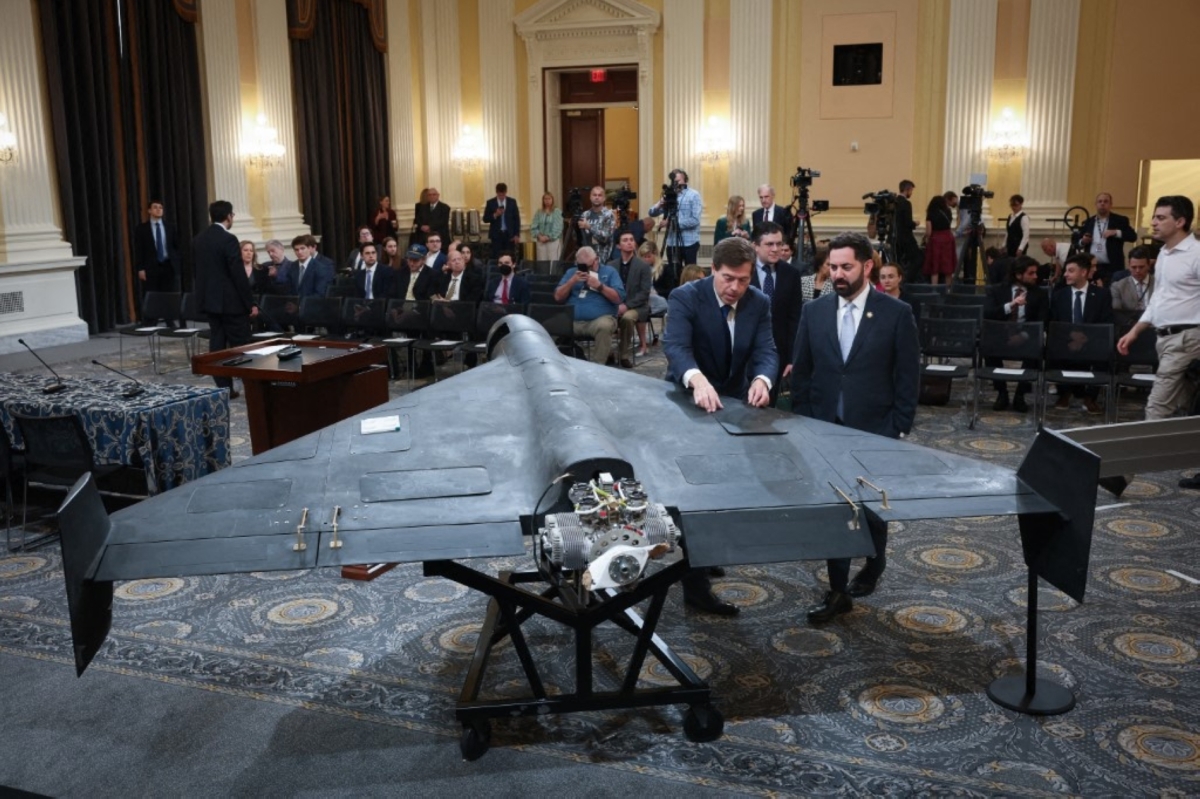 Mark Wallace (L), CEO of the non-profit United Against Nuclear Iran, talks with Rep. Mike Lawler (R) (R-NY) next to a Shahed 136 military drone during a press conference on Capitol Hill on 8 May 2025 in Washington, DC.