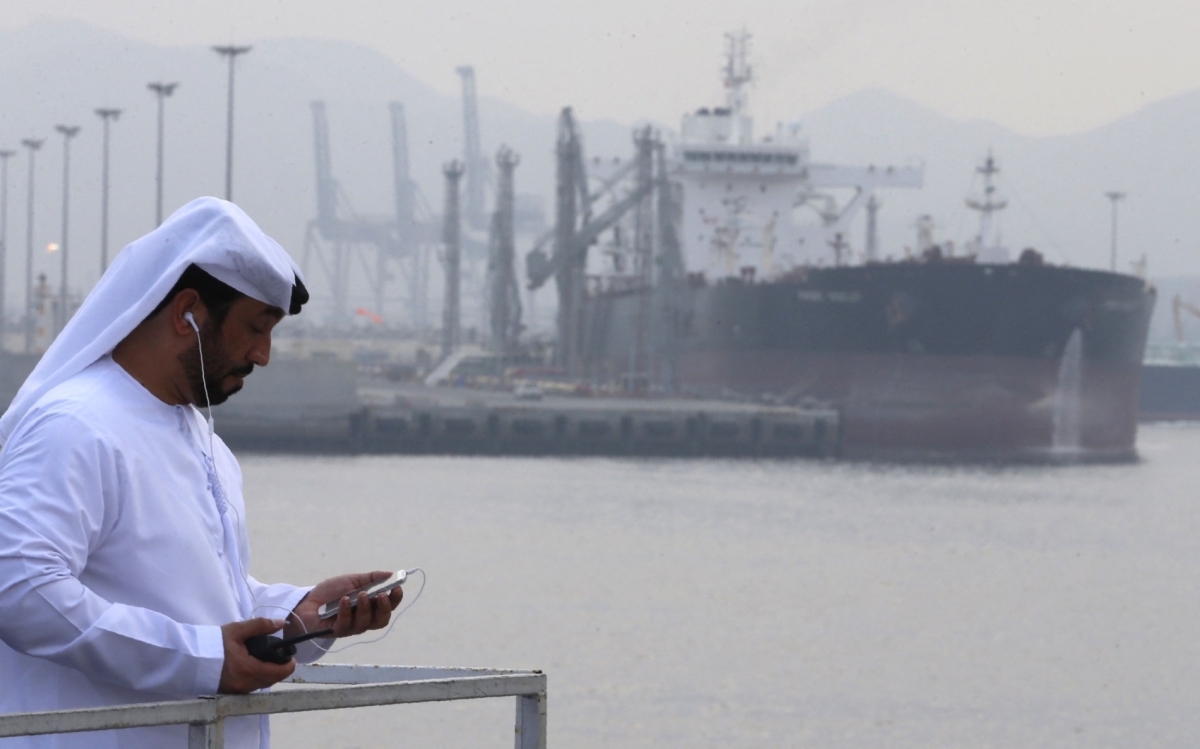 An Emirati man stands at the oil terminal of Fujairah during the inauguration ceremony of a dock for supertankers on 21 September 2016.