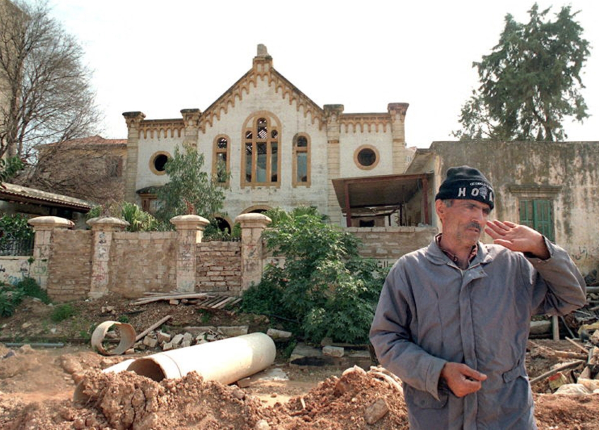 A Lebanese guard stands in front of  Magen Abraham, the last Jewish synagogue in Lebanon at Wadi Abou Jmil, Beirut's former Jewish neighbourhood, in the war-devastated city centre.