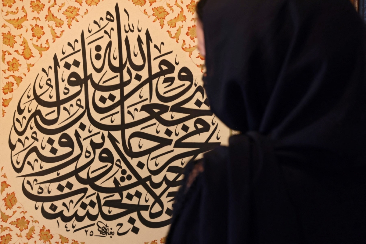 A woman tours the calligraphy museum at Sharjah Centre for the Art of Arabic Calligraphy and Ornamentation, in the United Arab Emirates, on 19 December 2021. 