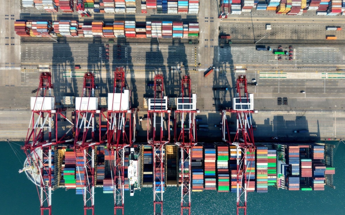 A container ship is seen at berth at the container terminal of the port in Qingdao, in China’s eastern Shandong province, on 2 April 2026. 