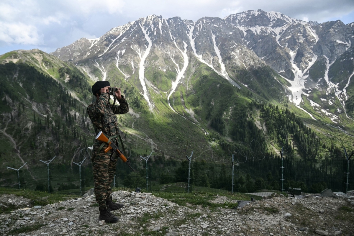 An Indian army soldier stands guard near the Line of Control (LoC) in India's Kashmir region on 19 May 2025.