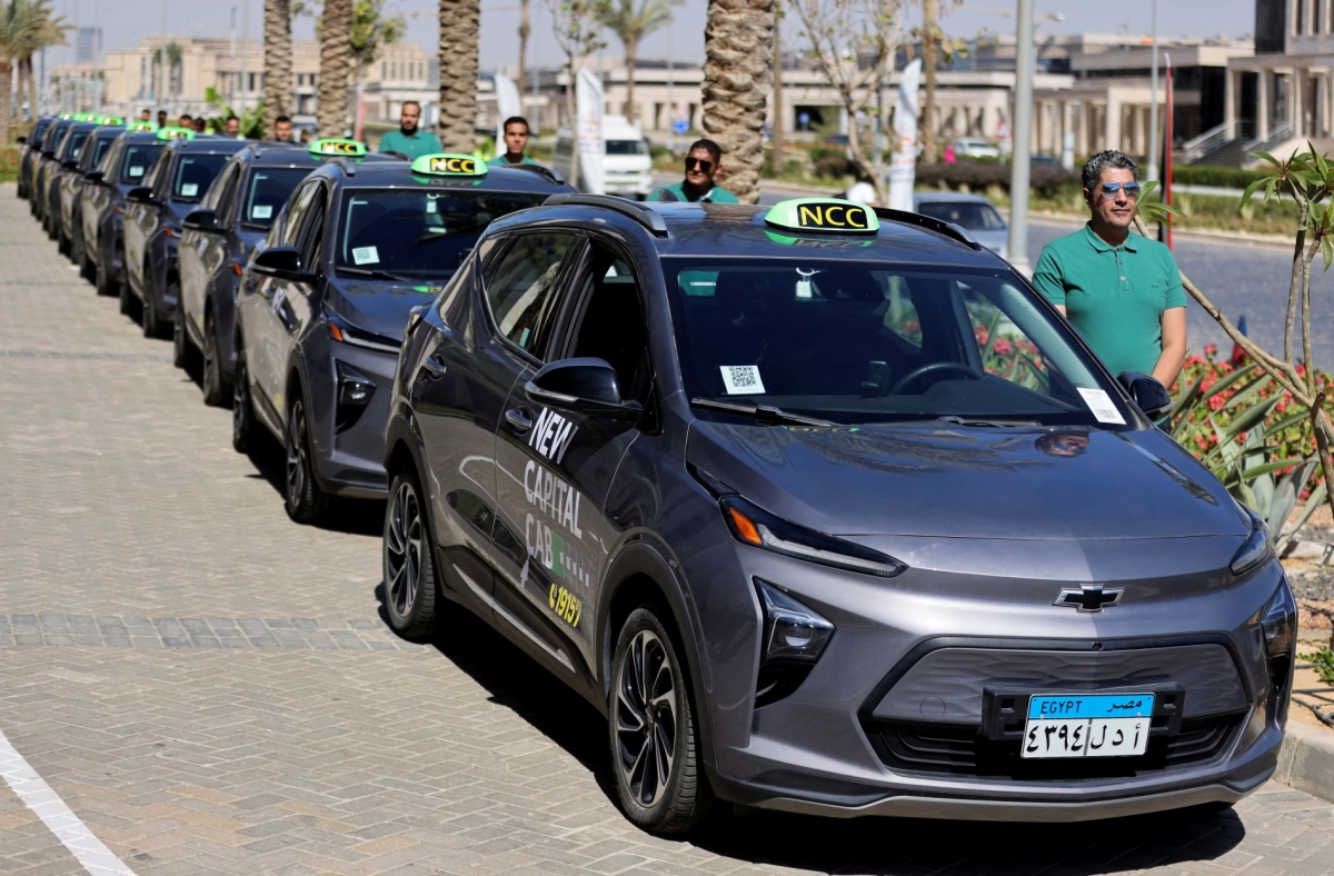 Drivers stand near electric cars, as Egypt began operating first electric taxis service, providing an eco-friendly ride-hailing solution for people in Cairo, on 16 May 2024. 