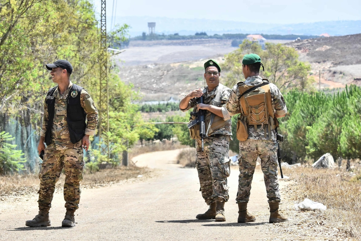 Lebanese soldiers stand on a road near the entrance to the southern village of Zawtar al-Garhbiya on July 21, 2026.