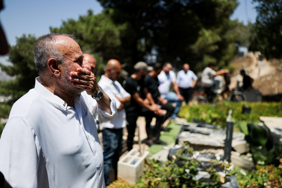 Mustafa Ali Abu Bakr, 76, stands in front of his family’s graves after they were broken by Israeli soldiers near Nablus in the Israeli-occupied West Bank, on 31 July 2026.