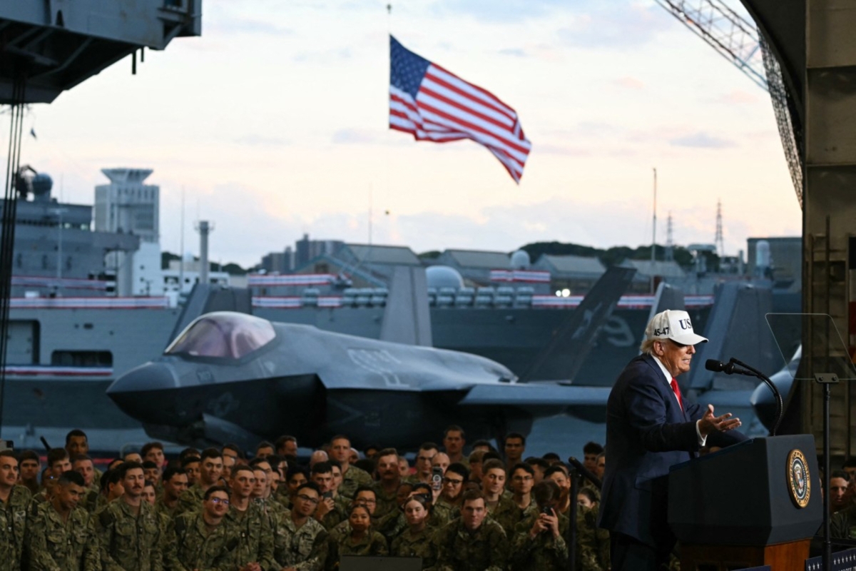 US President Donald Trump addresses members of the Navy aboard the aircraft carrier USS George Washington at Yokosuka Naval Base on 28 October 2025. 

