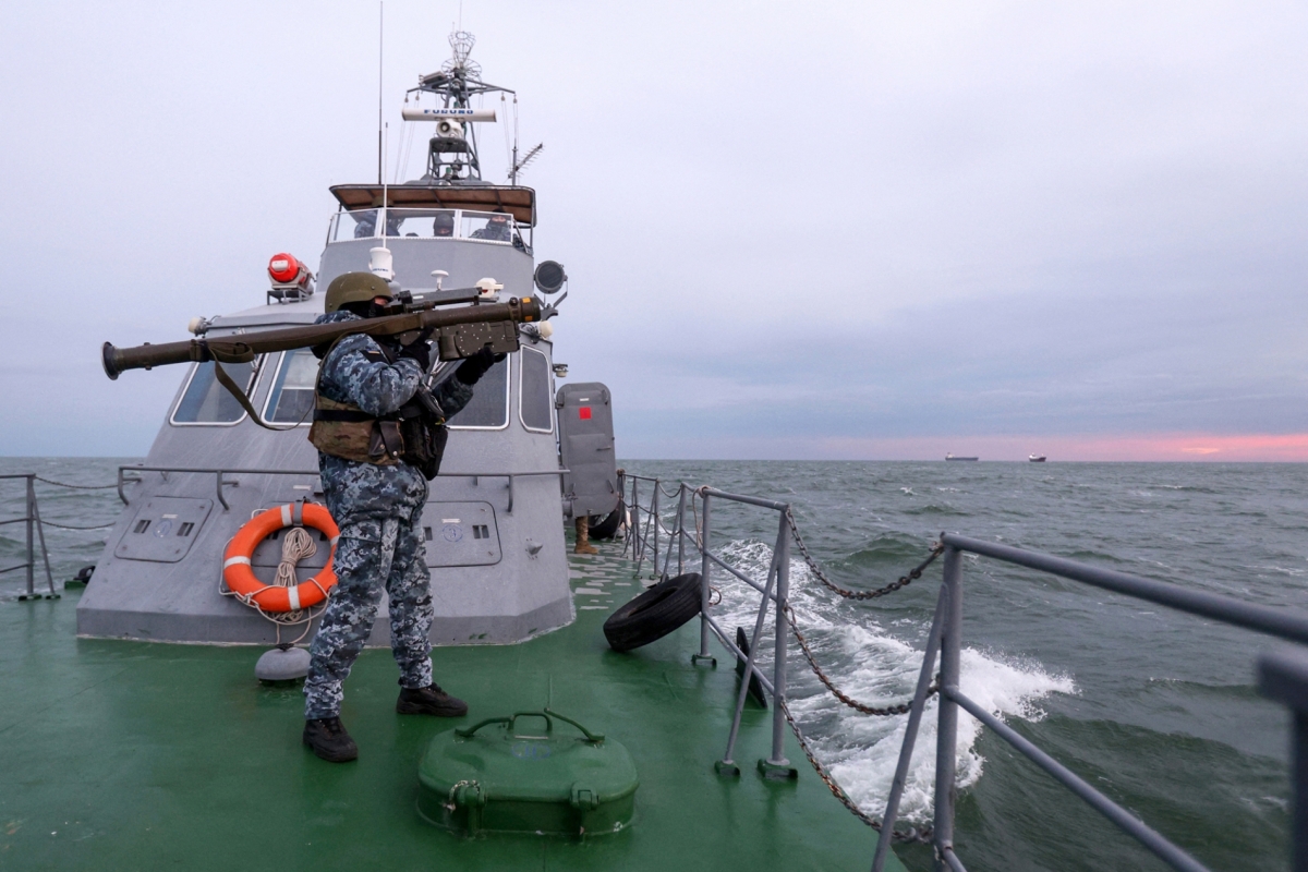 A Ukrainian soldier carrying a Stinger anti-aircraft missile aboard a maritime guard boat in the northwestern part of the Black Sea on 18 December 2023.
 