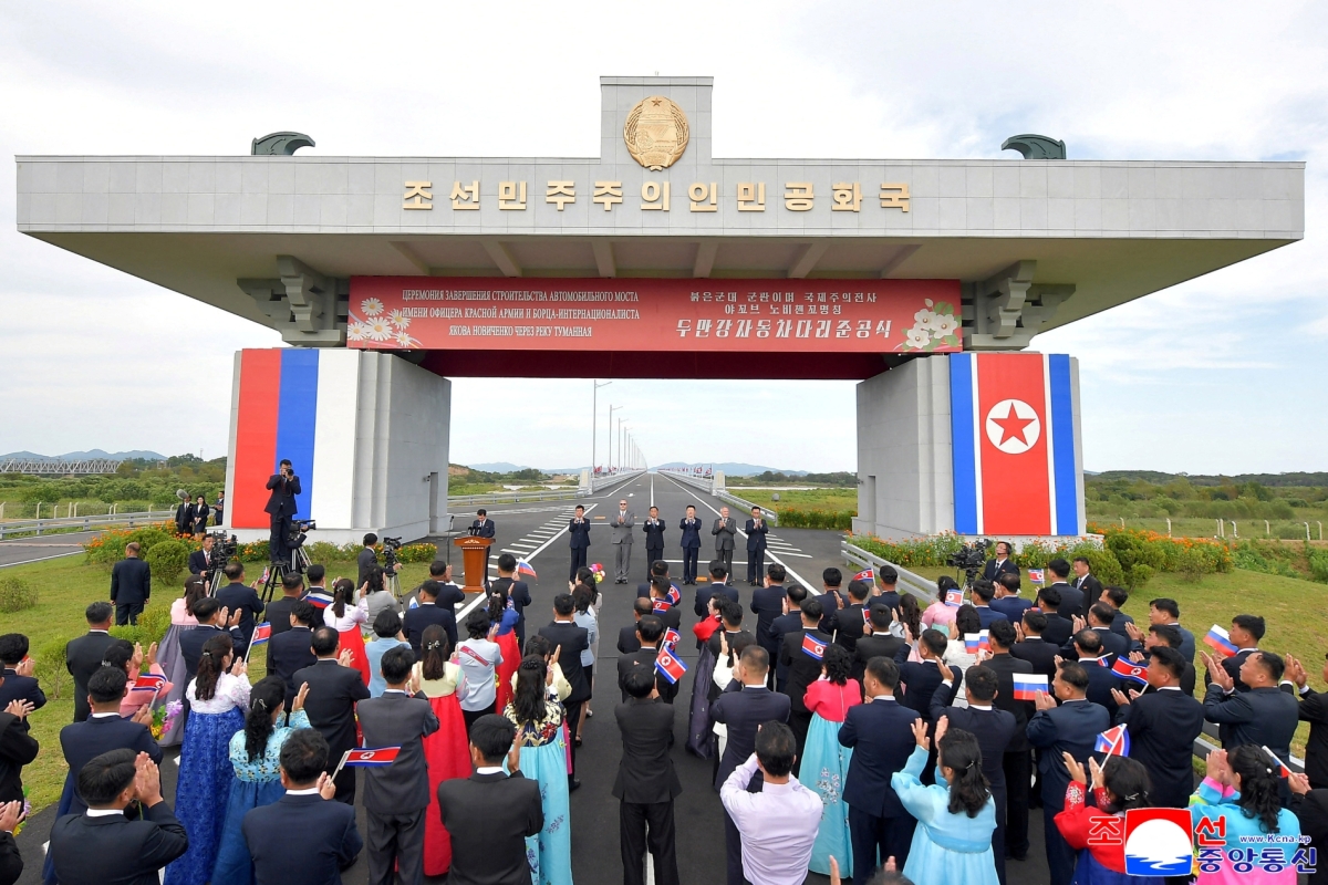 Attendees applaud as North Korea and Russia open their first road bridge, a structure that spans the Tumen River, connecting the border cities of Rason and Khasan, on 7 September 2026. 