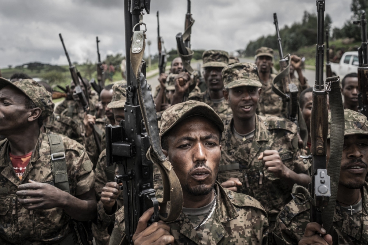 Soldiers from the Ethiopian National Defence Force chant slogans after completing their training at an officers' training ground 70 kilometres northeast of the city of Gondar, Ethiopia, on 14 September 2021.