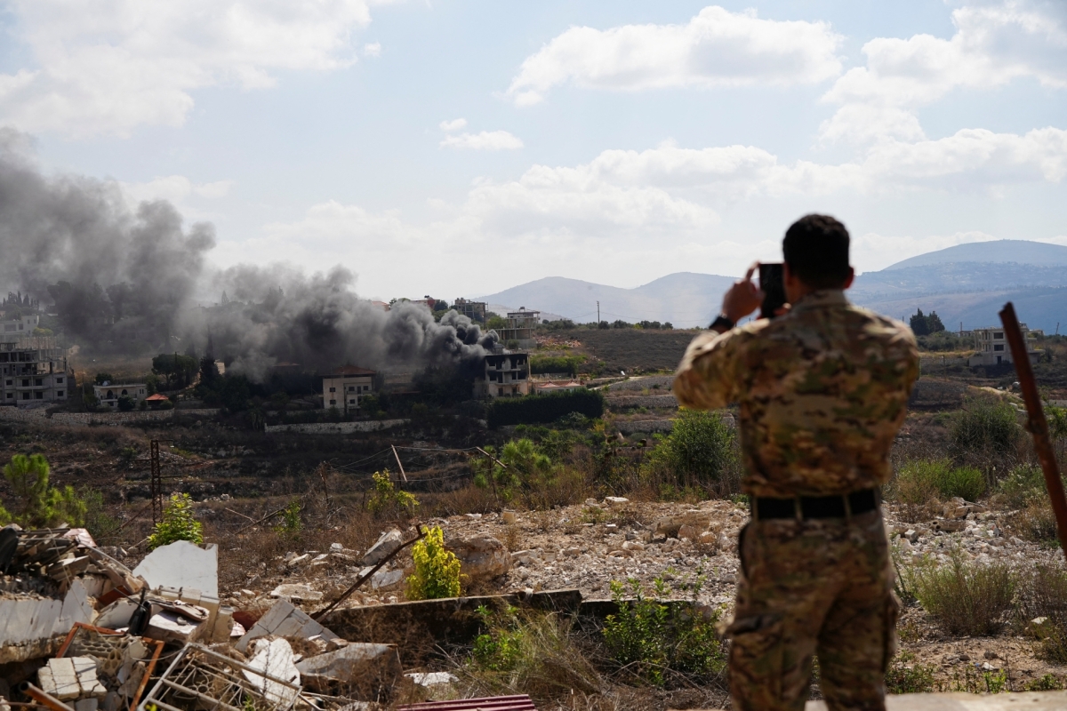 A Lebanese soldier films a house in south Lebanon destroyed by Israel on 22 September 2026.