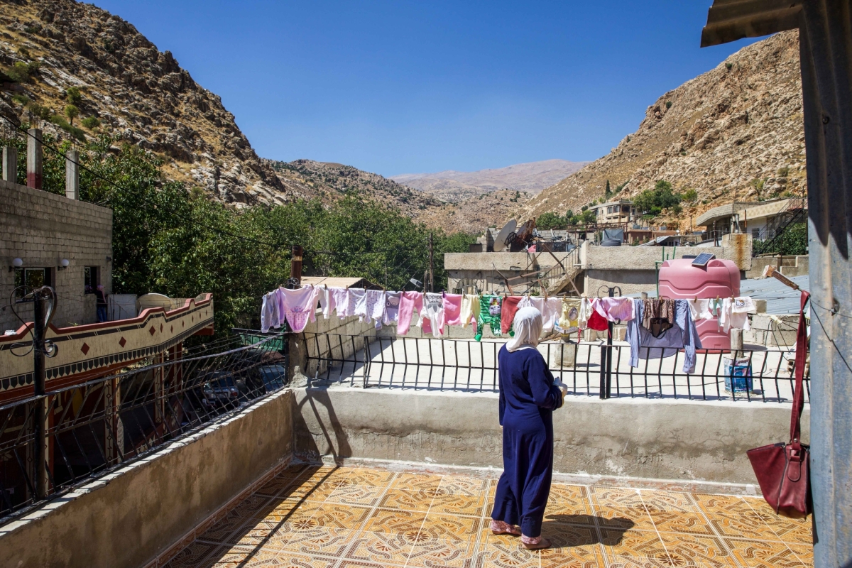 Safa Alsafadi, activist, looking at the mountain from her rooftop; Location: Beit Jinn (Mount Hermon)