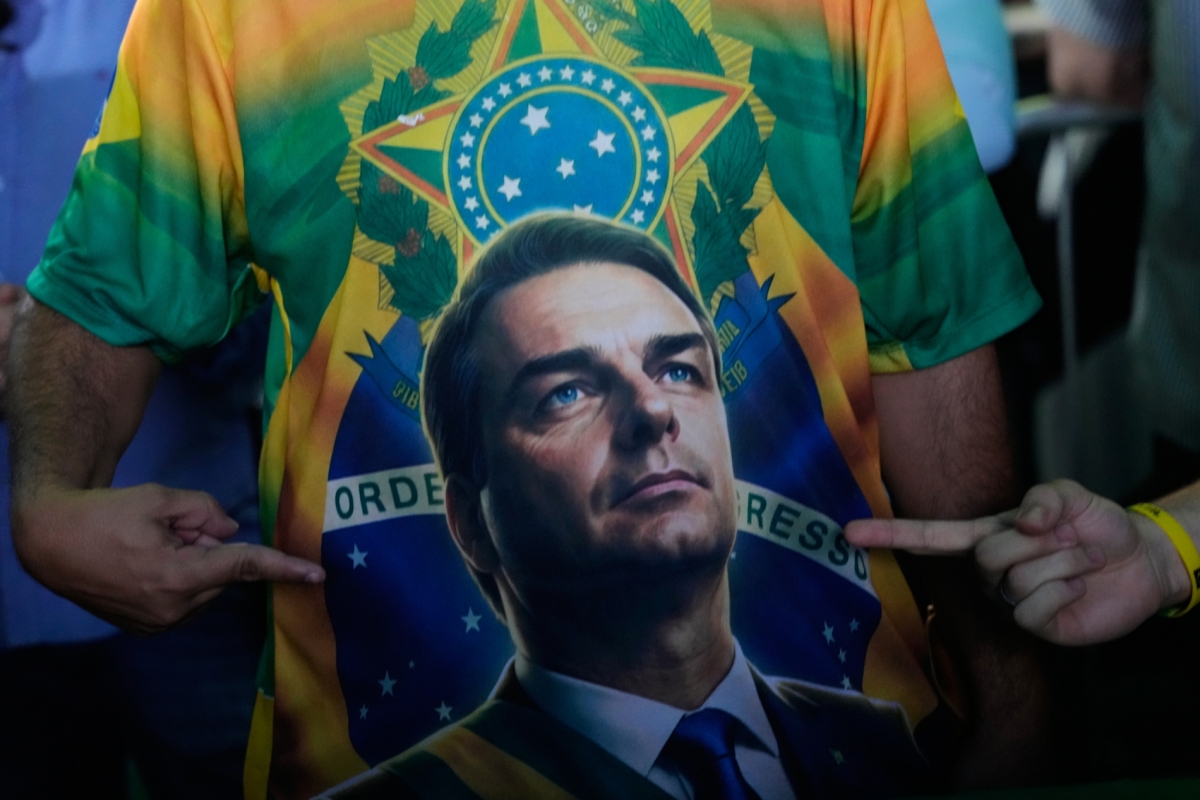 A supporter wears a T-shirt of opposition presidential candidate Sen. Flavio Bolsonaro during a rally to launch his runoff campaign in Goiania, Brazil, on 6 October 2026. 