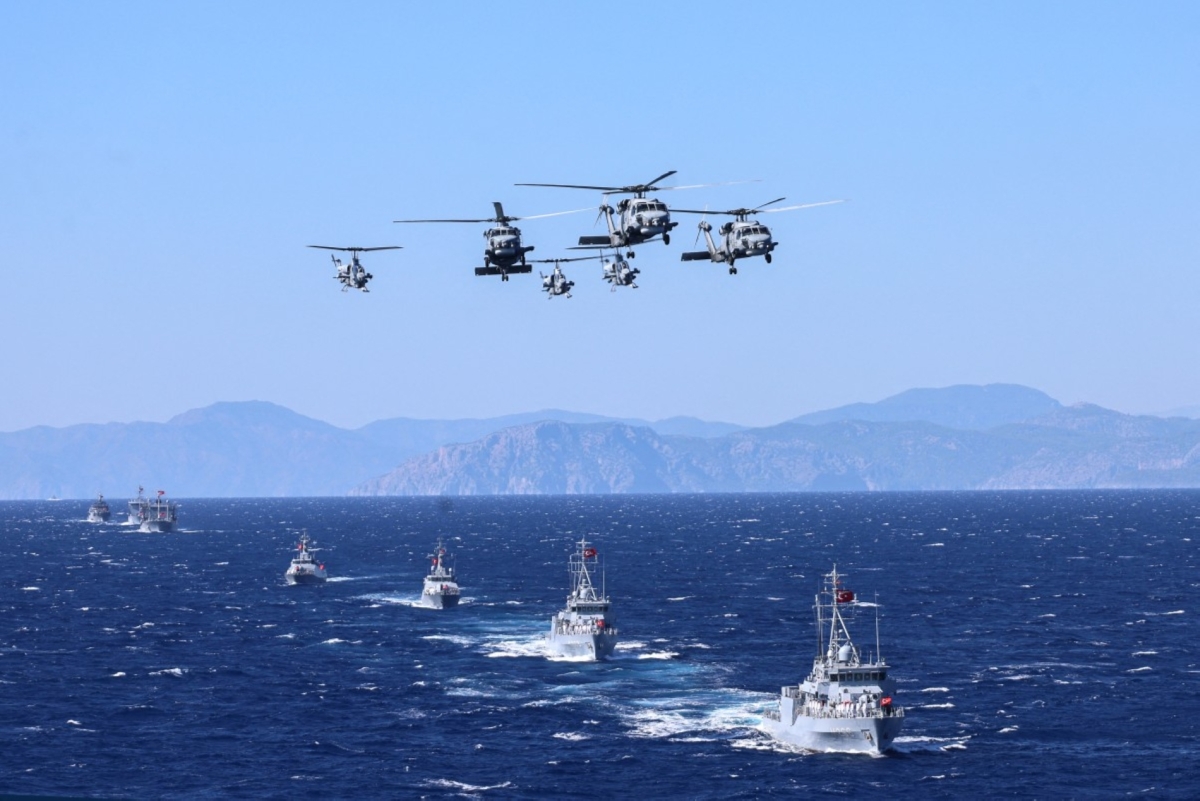 Turkish Navy's UH-60 Black Hawk (naval/S-70B variant) with T129 ATAK participate in a ceremonial parade during the Denizkurdu-I/2026 Exercise in the Eastern Mediterranean, off the coast of Aksaz, in Mugla, on 24 September 2026.