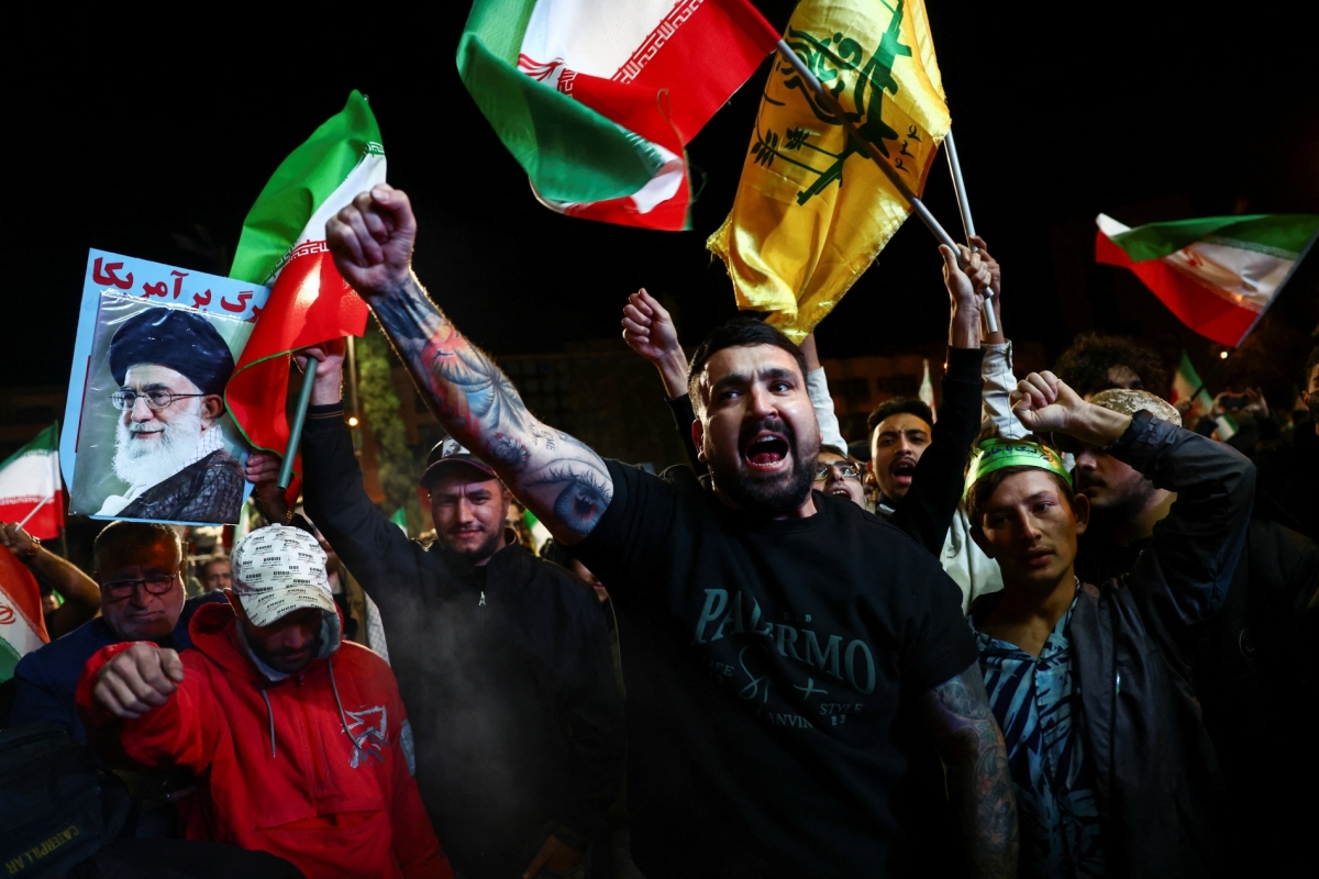 People shout slogans as they gather after a two-week ceasefire in the Iran war was announced, in Tehran, Iran, on 8 April 2026.