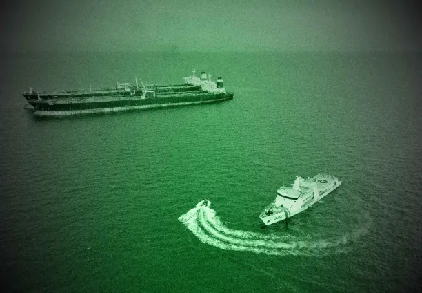 An Iranian-flagged vessel MT Arman 114 (top L, in front) beside the Cameroon-flagged ship MT S Tinos conducting a suspected illegal transhipment in the waters of Indonesia's exclusive economic zone in the Natuna Sea on 7 July, 2023.