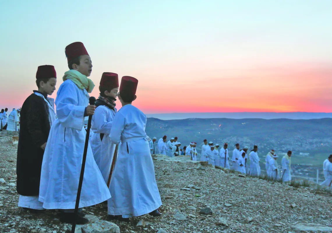  Samaritan children participate in an early morning Passover ceremony at Mount Gerizim near the northern West Bank city of Nablus, on April25 , 2019. (Getty)