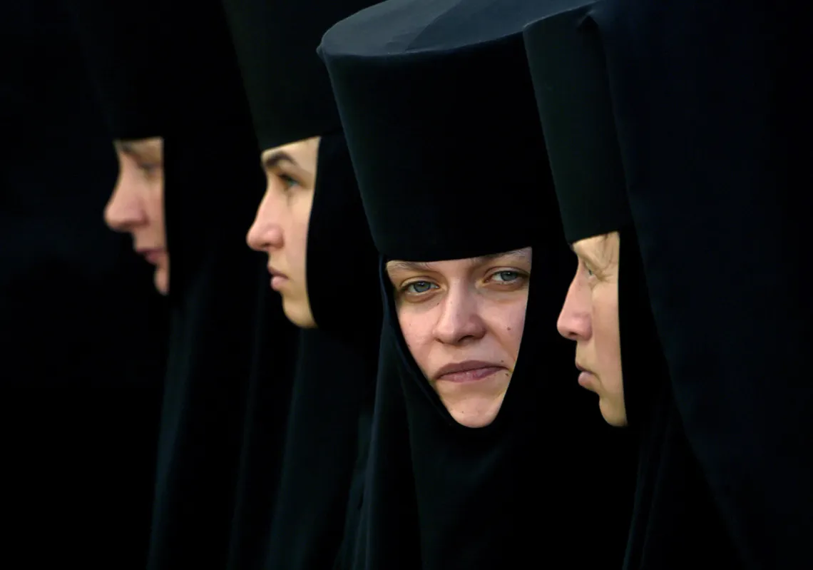 Orthodox nuns look on as they take part in a religious procession during the celebration of the 1031st anniversary of the Christianisation of Kievan Rus in Kiev. (Getty)
